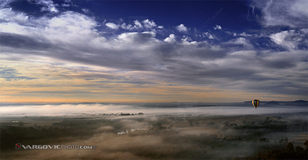 Magnificent foggy morning balloon winter flight above Australian wine-growing areas Hunter Valley near to town Cessnock in the state of New South Wales as the best Croatian travel photo of the year 2014