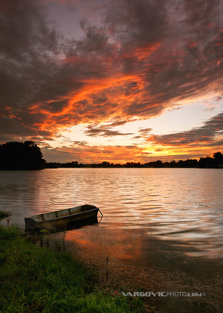 Great Bloody sunset on the Soderica lake in the middle of Podravina district, Croatia by art photographer Boris Vargovic
