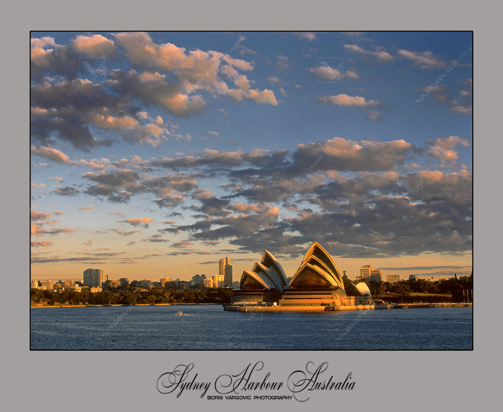 Golden sun light above Opera House and Sydney Harbour in the Australian state New South Wales by art photographer Boris Vargovic